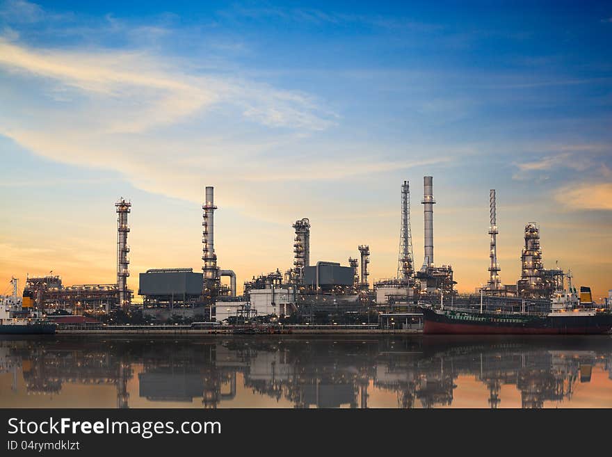 Refinery plant area at twilight with reflection