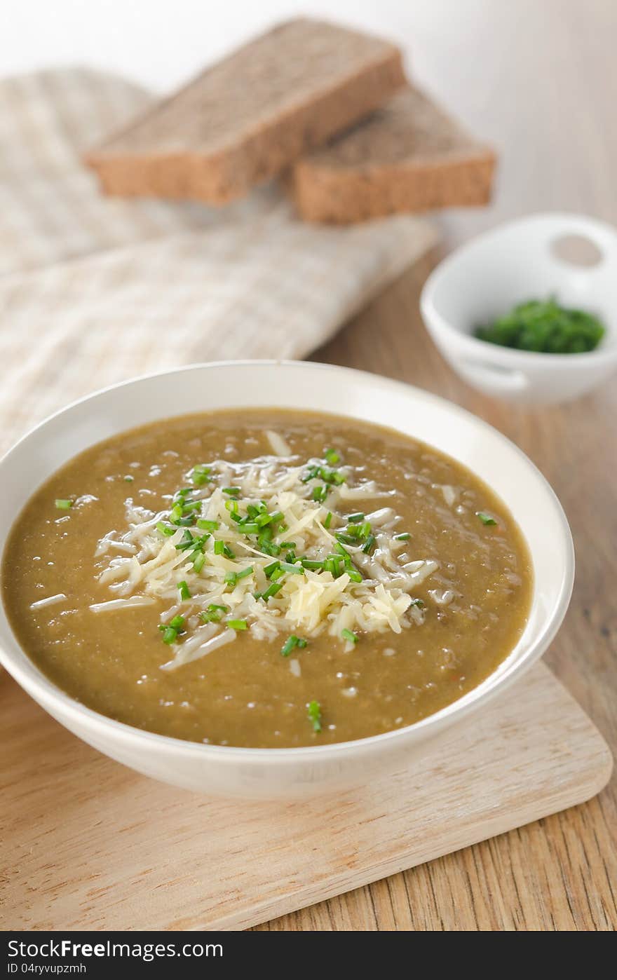 Lentil soup with cheese and green onions