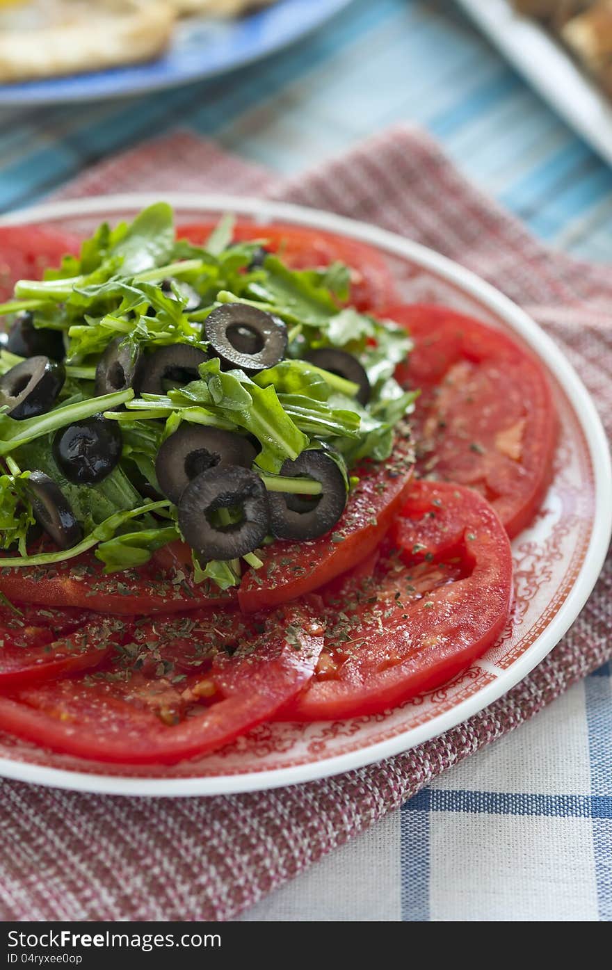 Tomato Salad With Olives And Arugula