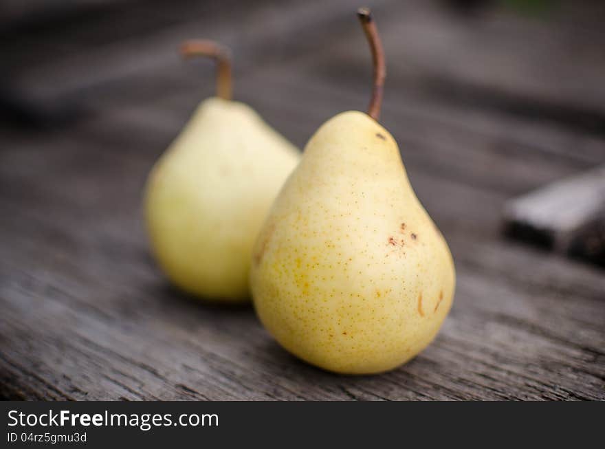 Homegrown pears on wooden background. Shallow depth of field.