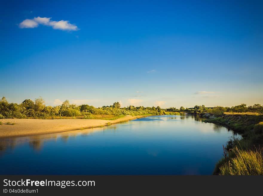 Wide panorama of a river and the forest