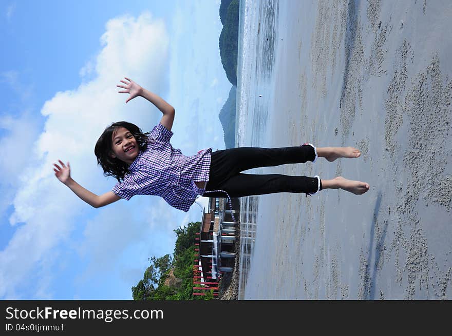 Girl Jumping On Beach