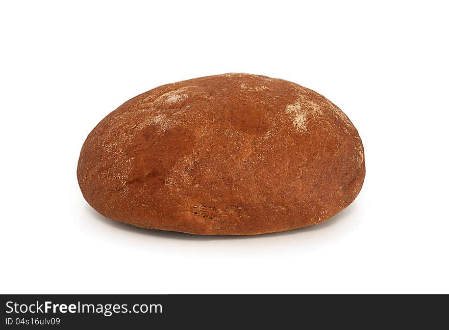 Round rye bread lying on white background. Clipping path is included