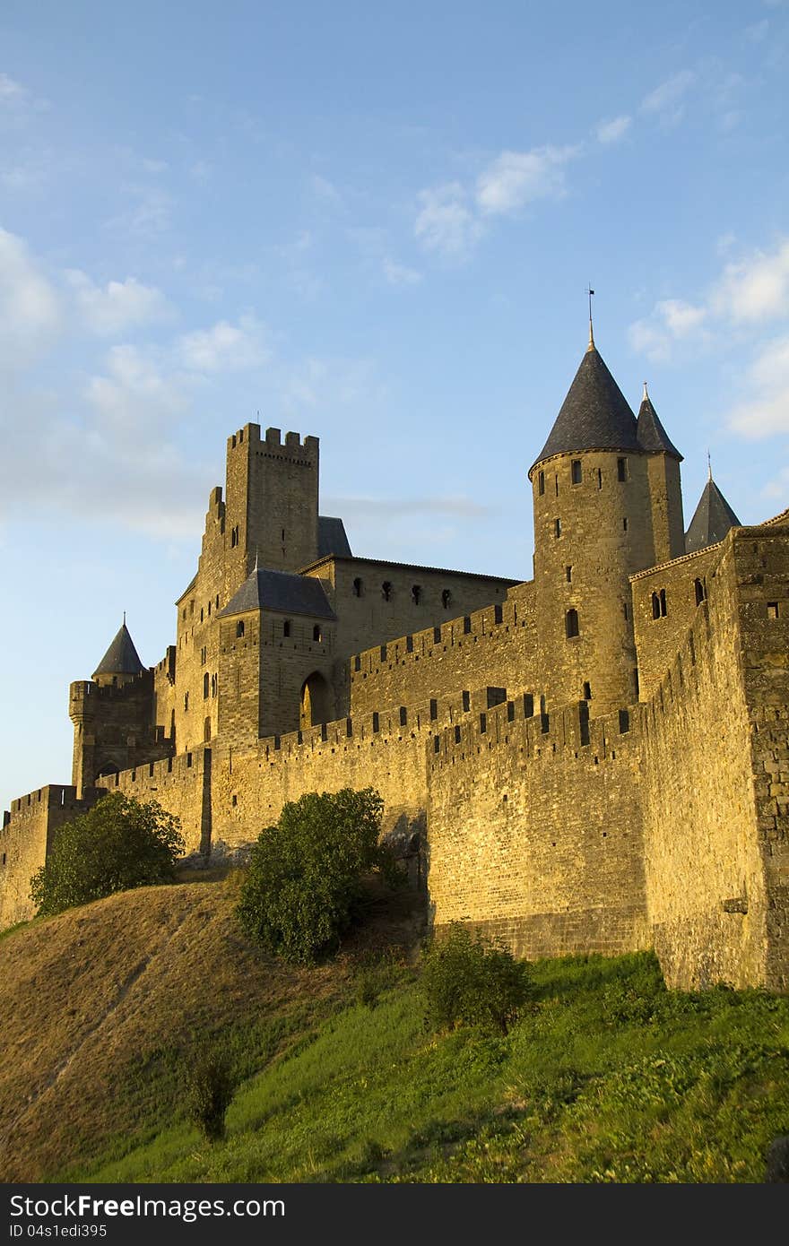 The beautiful fortified town on Carcassonne in Southern France pictured at dusk. The beautiful fortified town on Carcassonne in Southern France pictured at dusk