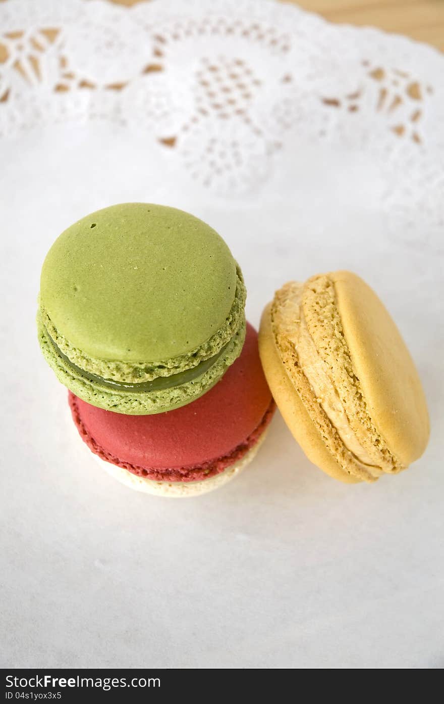 Three color french macarons dessert on table. Three color french macarons dessert on table