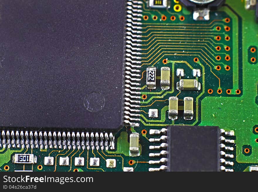 Digital hardware closeup. Microchips assembly on the circuit board macro