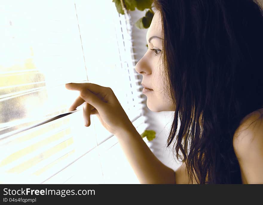 Girl looks out the window