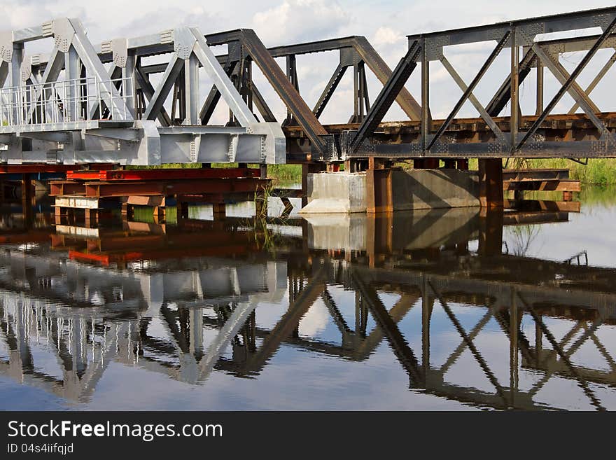 Maintenance Of Railway Bridge, Water Reflection.