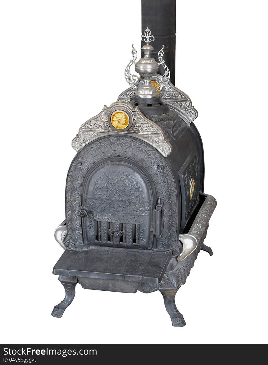 Vintage fancy cast iron wood burning heater stove with engraving and stainless steel decorations. Isolated on white. Vintage fancy cast iron wood burning heater stove with engraving and stainless steel decorations. Isolated on white.