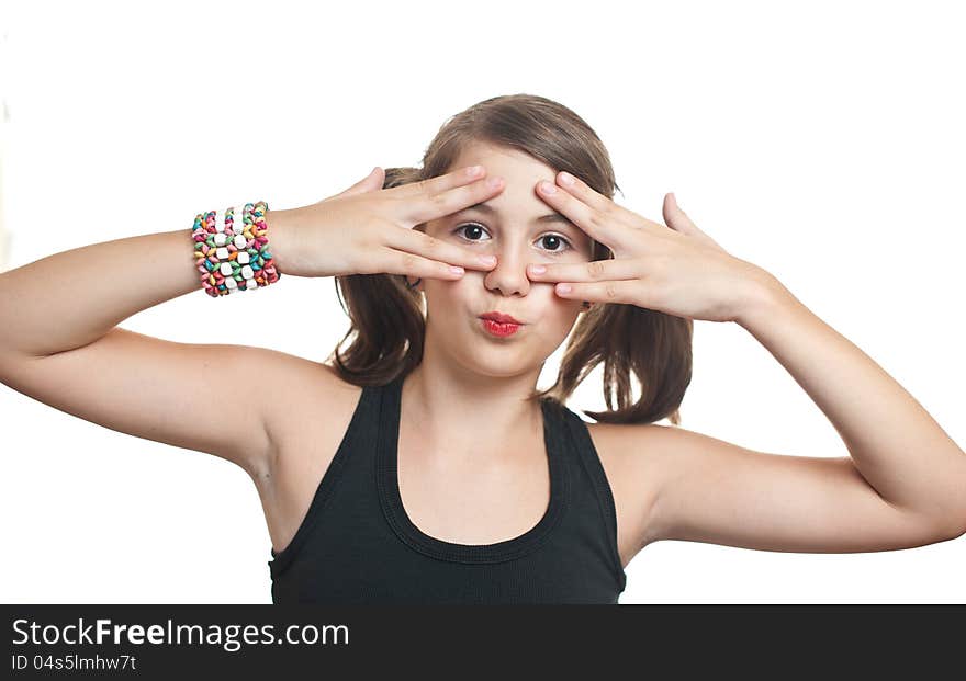 Girl covering eyes and peeping through her fingers