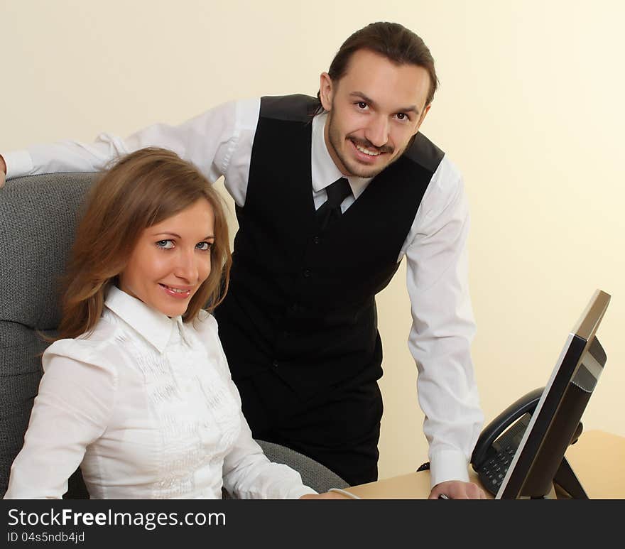 Businessman and businesswoman smiling with computer. Businessman and businesswoman smiling with computer