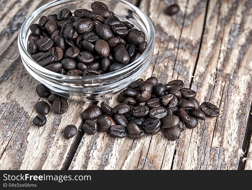 Close up of coffee beans on old wooden table