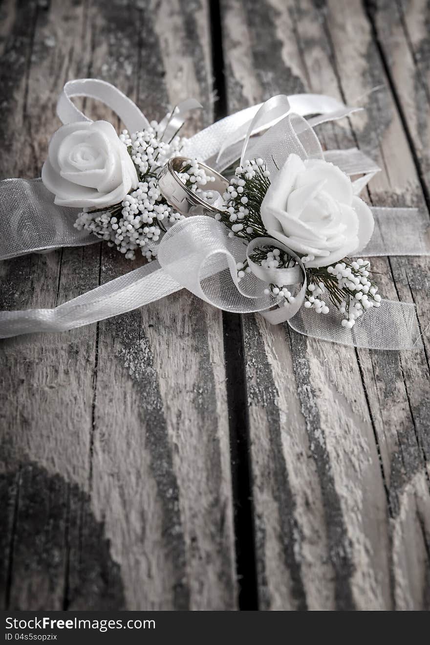 Wedding accessories on  old wooden plank