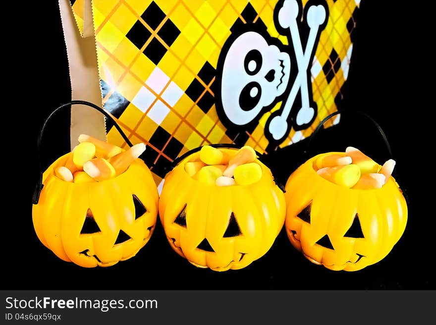 Jack o lanterns filled with candy corn for trick or treat. Jack o lanterns filled with candy corn for trick or treat