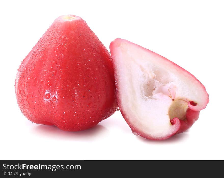 Rose apple sliced into half isolated on white background