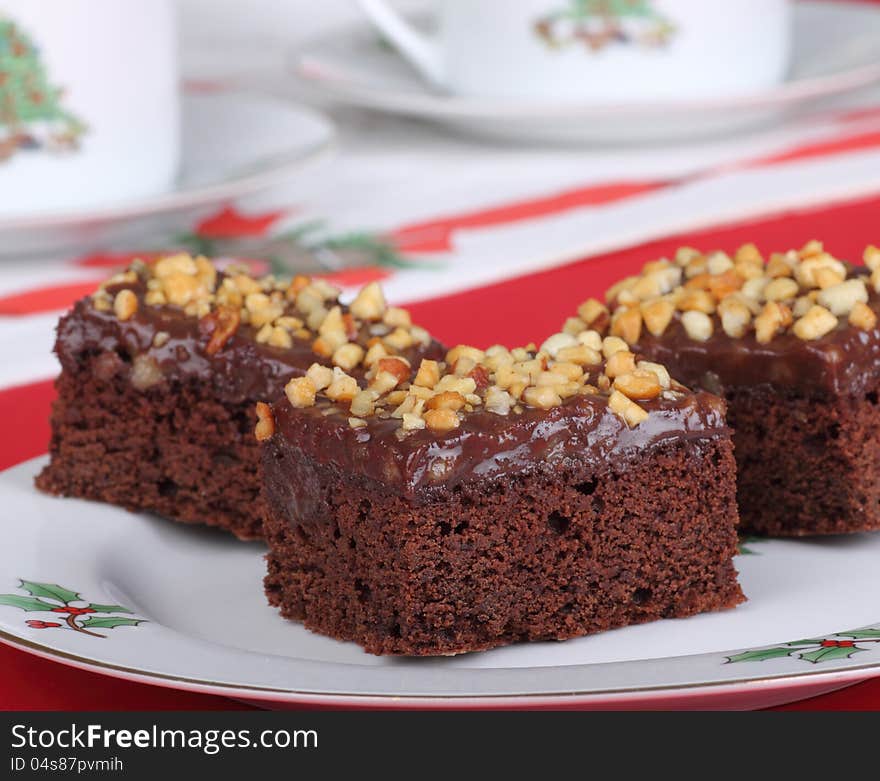 Christmas plate of fudge brownies topped with nuts. Christmas plate of fudge brownies topped with nuts