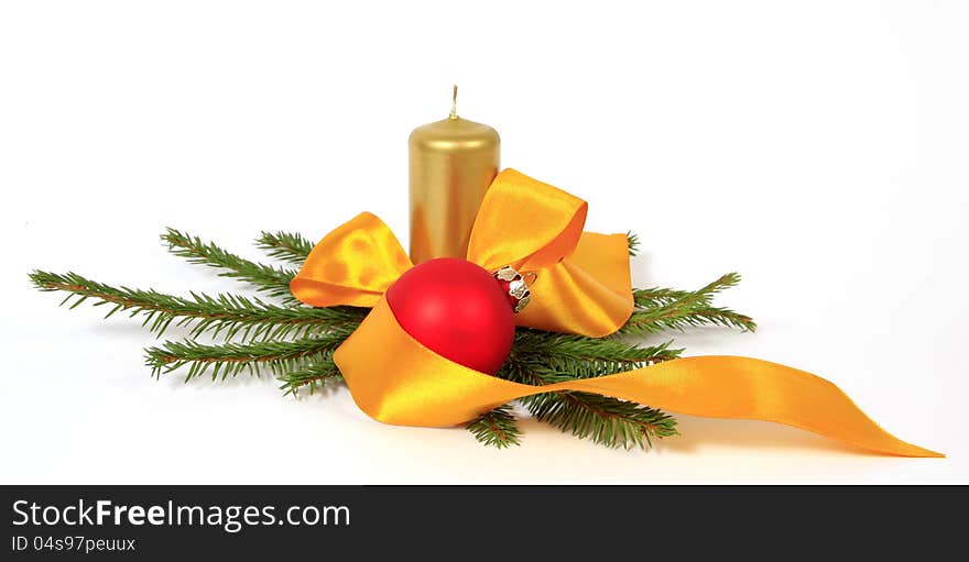 Christmas decoration with the red bulb, twigs of the spruce and candle