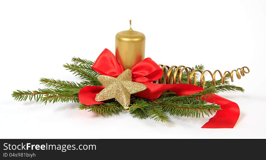 Christmas decoration with the gold star, twigs of the spruce and candle