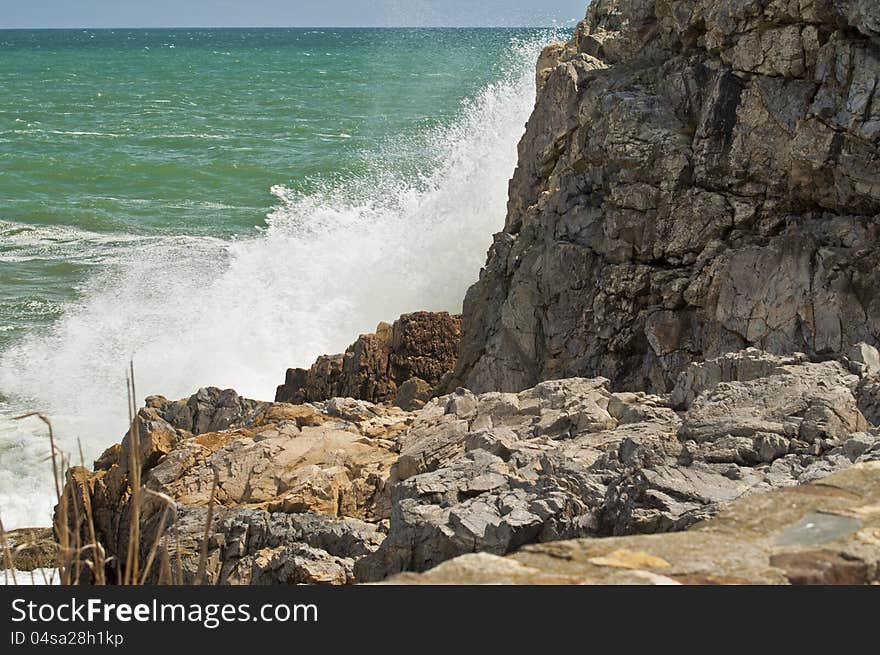 This is a splash of ocean against the rocks of the sea. This is a splash of ocean against the rocks of the sea.