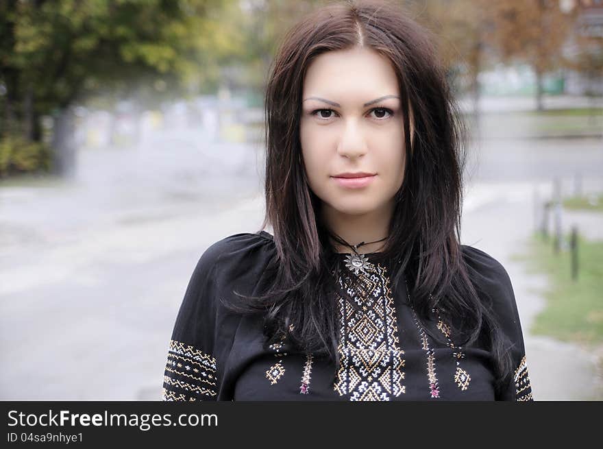 Stylish girl with beautiful hair. In National Embroidery