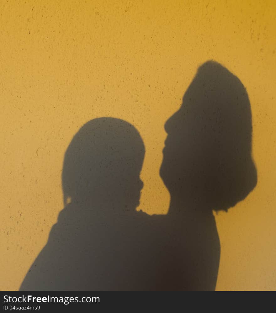 Shadows of woman and baby