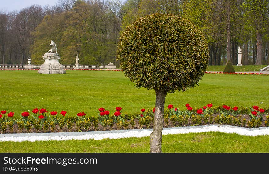 Castle Garden With Sculptures And Round Tree