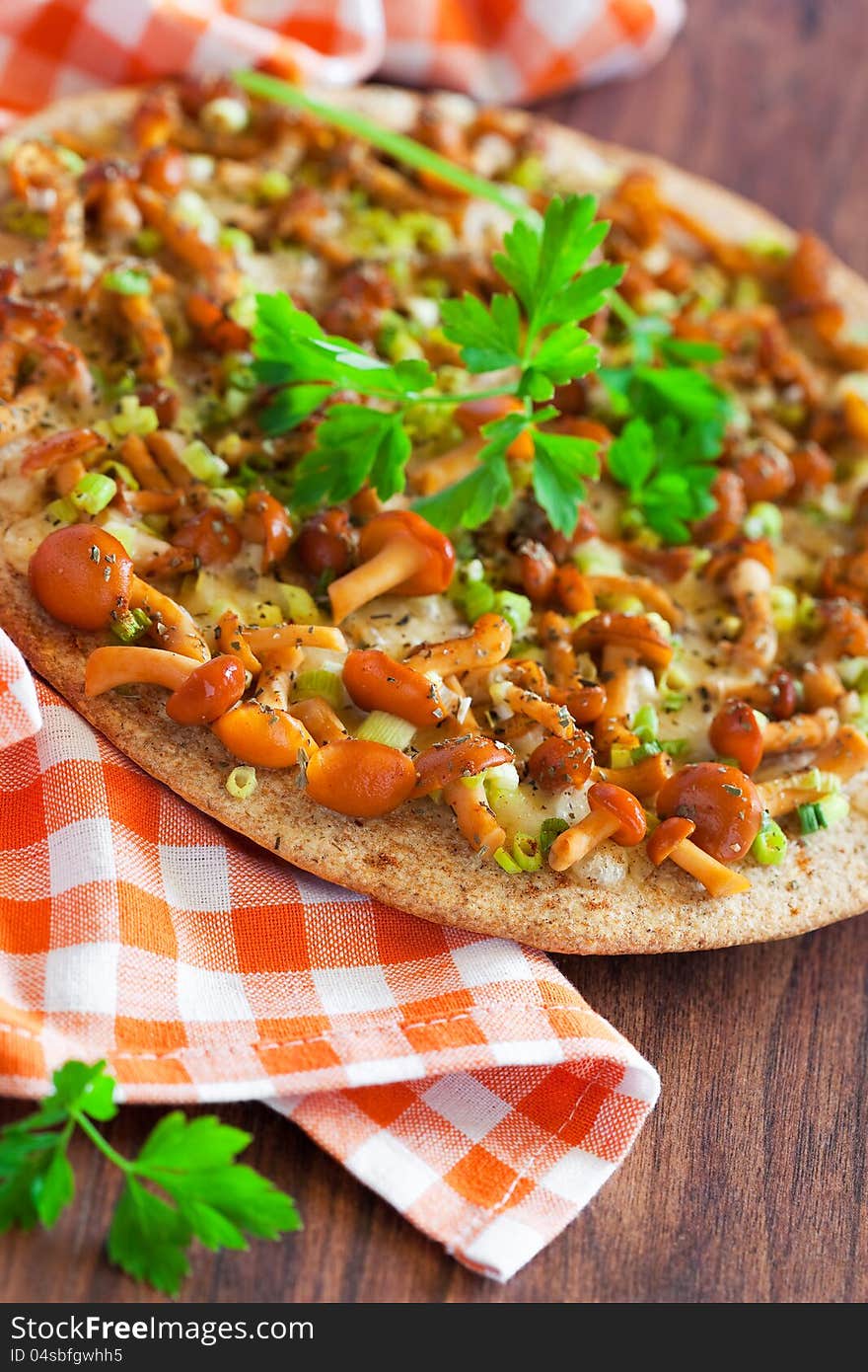 Oat bran flat bread with cheese and honey mushrooms, selective focus. Oat bran flat bread with cheese and honey mushrooms, selective focus