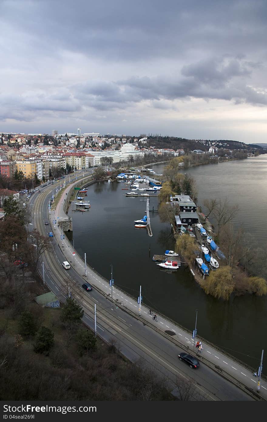 View from the top of the vltava river, barges and boats moored on the river vltava, road running along the river bank. View from the top of the vltava river, barges and boats moored on the river vltava, road running along the river bank