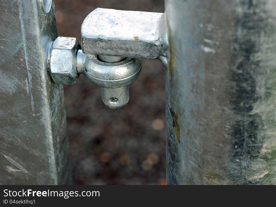 Newly erected galvanised gate hinge showing gate and post. Newly erected galvanised gate hinge showing gate and post.