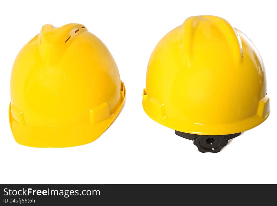 Two yellow construction helmet over white background. Two yellow construction helmet over white background