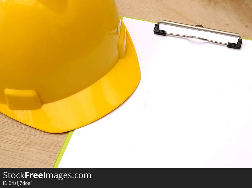 Yellow Helmet And Clipboard