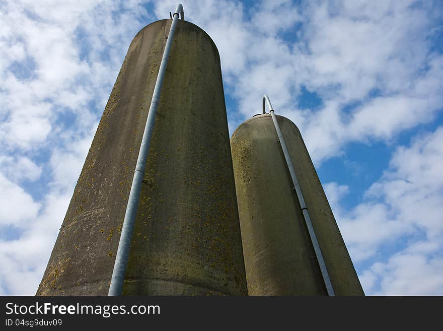 Agriculture farm grain silos in vertical angle facing the sky