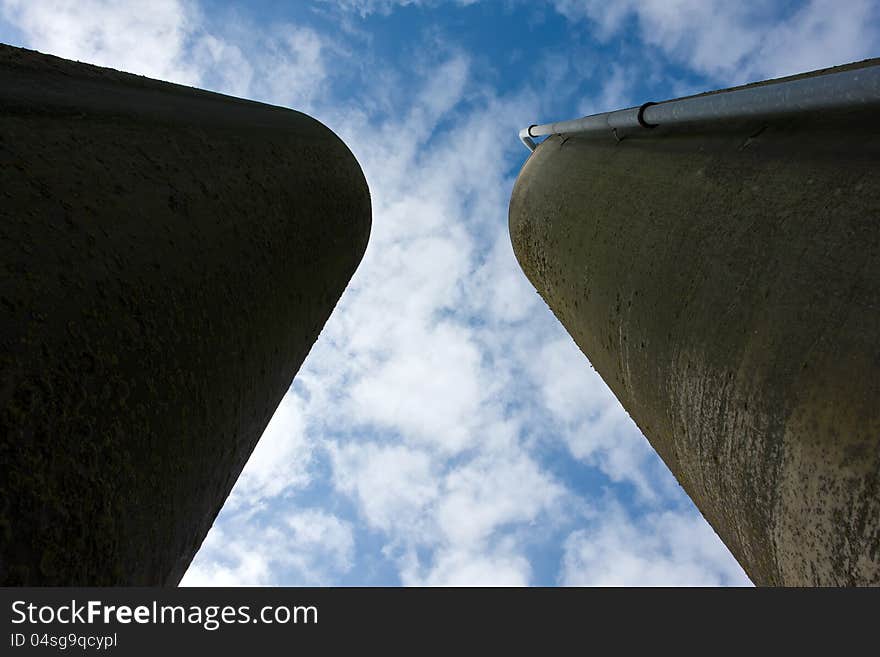 Agriculture farm grain silos in vertical angle facing the sky