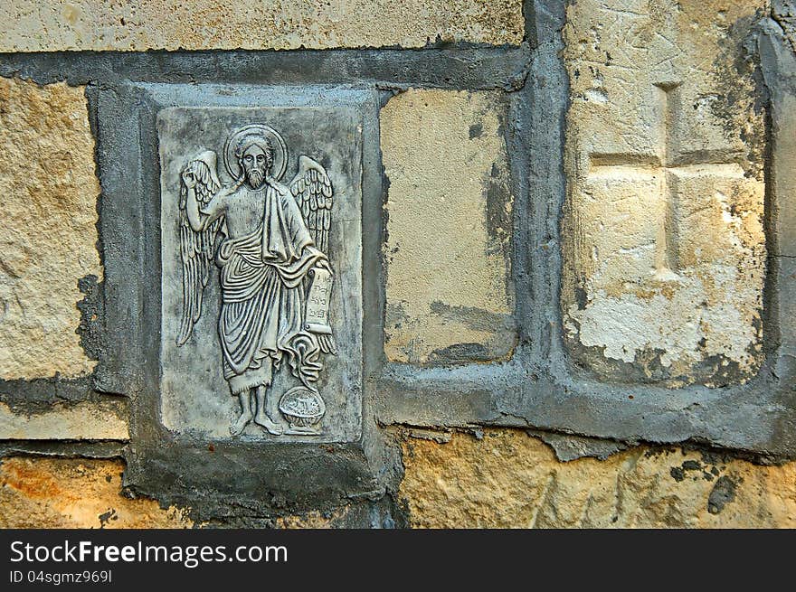 The rock monastery St Dimitrii of Basarbovo. The mural painting in the yard of monastery. Find it in the picturesque valley of the Rusenski Lom River, Bulgaria