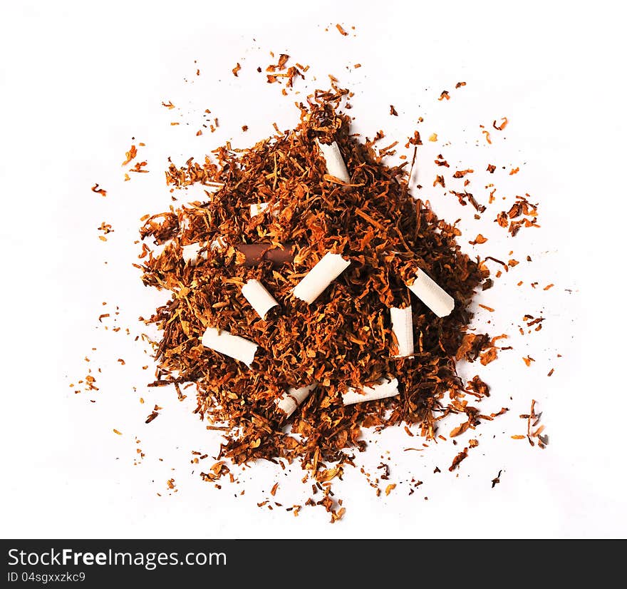 Pile Of Tobacco Leaves With Broken Cigarettes