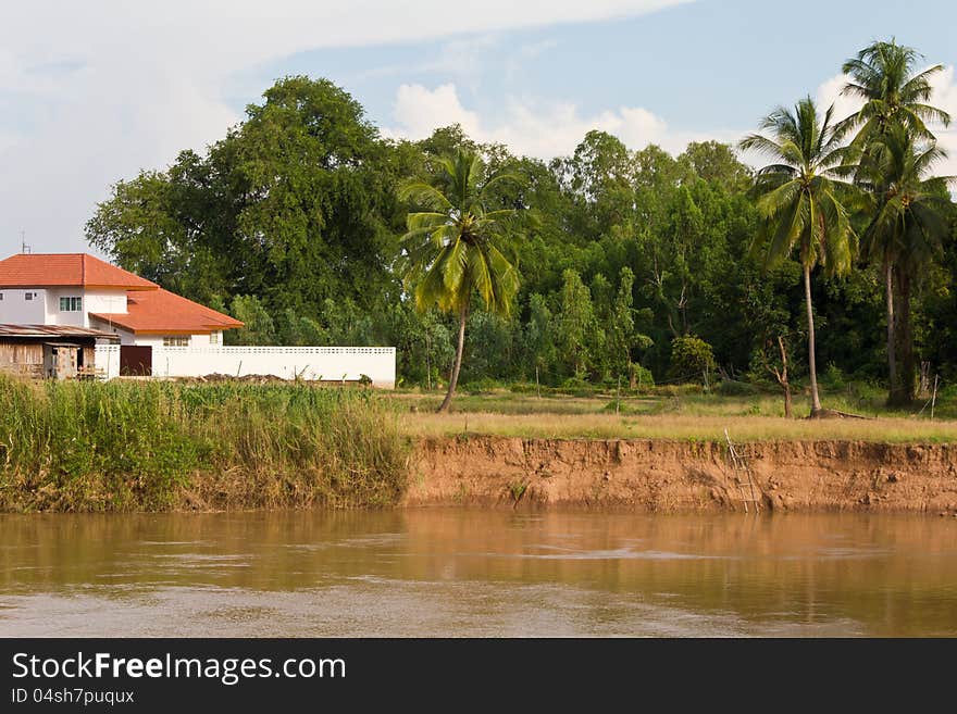 Soil erosion, coastal rivers near homes with red roofs coconut. Soil erosion, coastal rivers near homes with red roofs coconut.