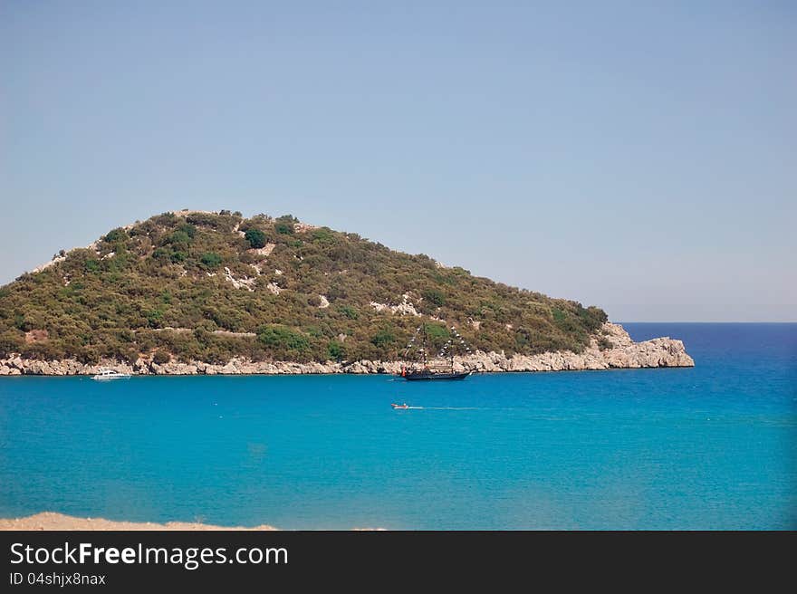 Green Island and the surrounding turquoise, calm sea with boats. Green Island and the surrounding turquoise, calm sea with boats