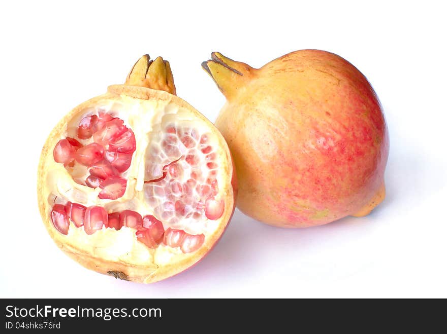 Pomegranate fruit with half isolated on white background