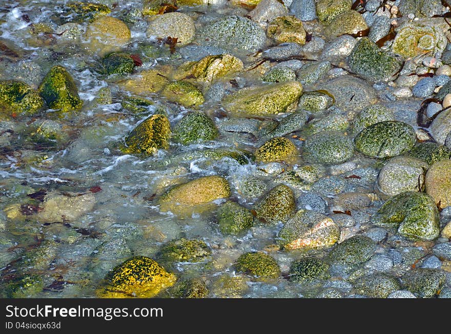 Colorful background of green yellow and gray rocks