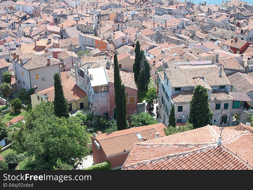 Old stone village with sea of roofs in background