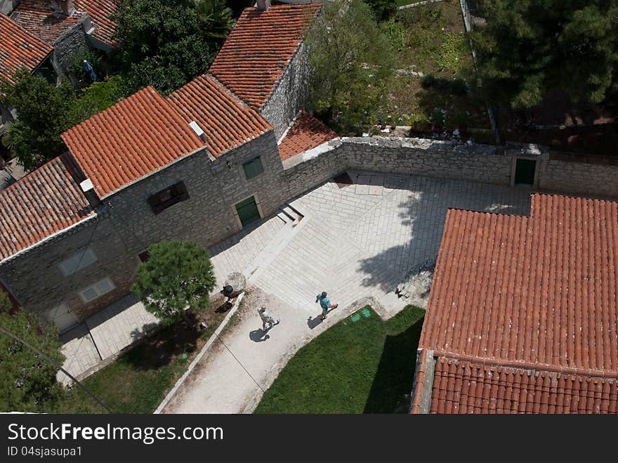 Old mediaeval village streets, white stone pavement and red Mediterranean roof in Croatia (Rovinj), seen form bell church of saint Evfemija. Old mediaeval village streets, white stone pavement and red Mediterranean roof in Croatia (Rovinj), seen form bell church of saint Evfemija