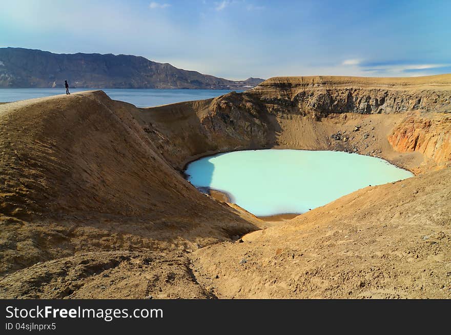 View of Viti volcano crater and person s silhouette, Askja, Iceland. View of Viti volcano crater and person s silhouette, Askja, Iceland