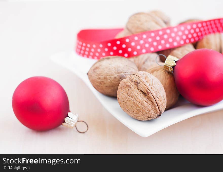 Christmas still life with  walnuts, ribbon and red balls. Christmas still life with  walnuts, ribbon and red balls.