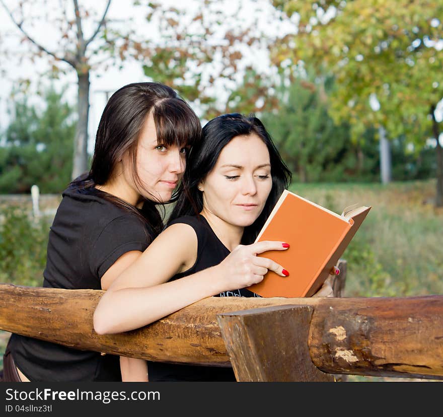 Two female friends on a bench