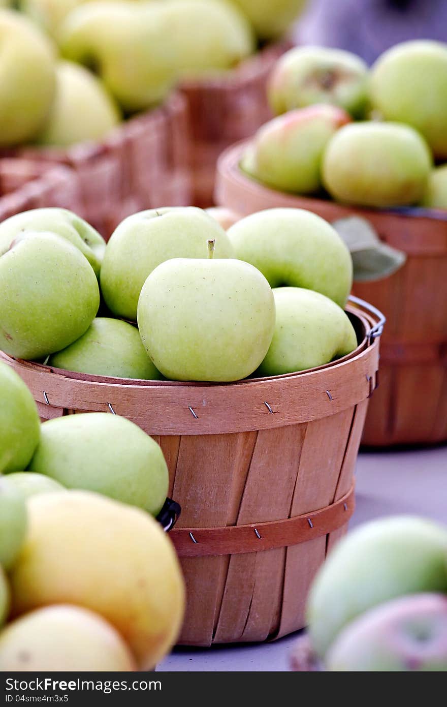 Baskets filled with green apples. Baskets filled with green apples