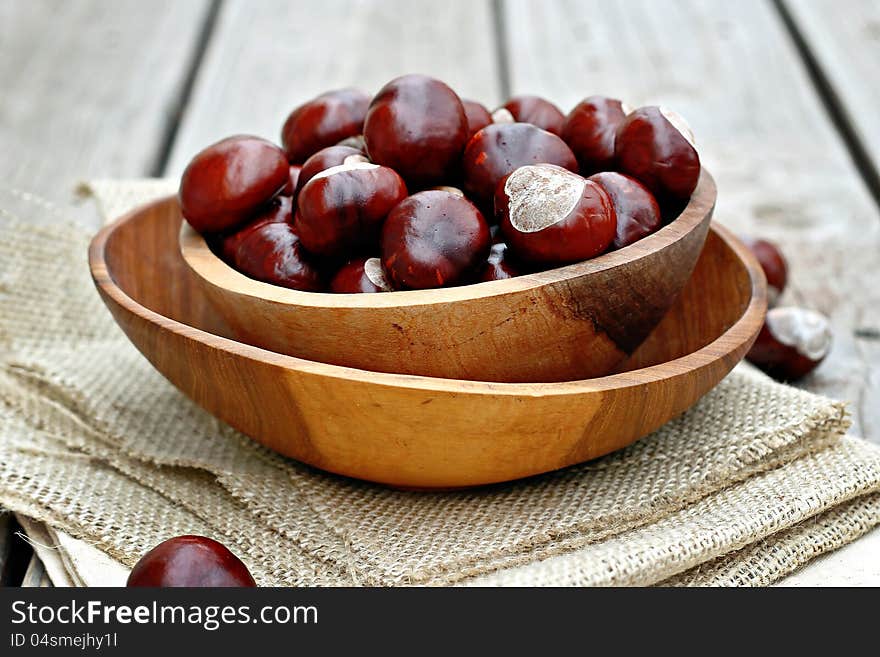 Chestnuts in a wooden bowl. Chestnuts in a wooden bowl.