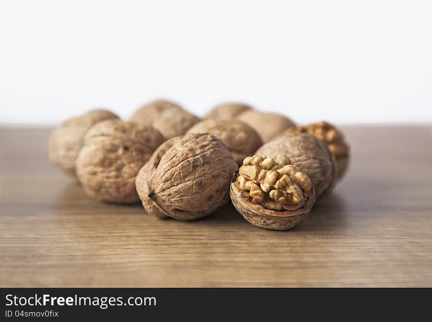 Walnuts on brown wood