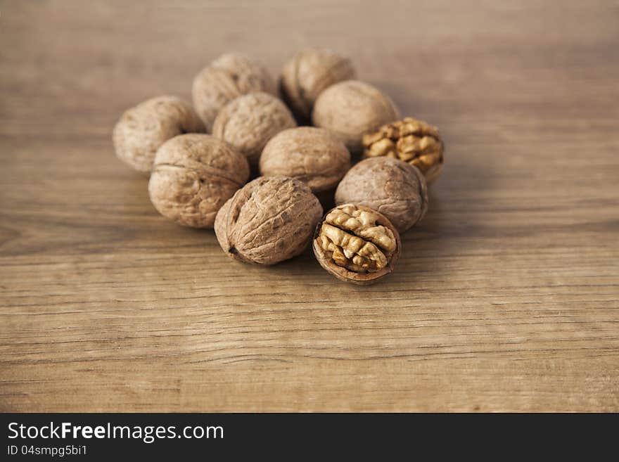 Walnuts on brown wood