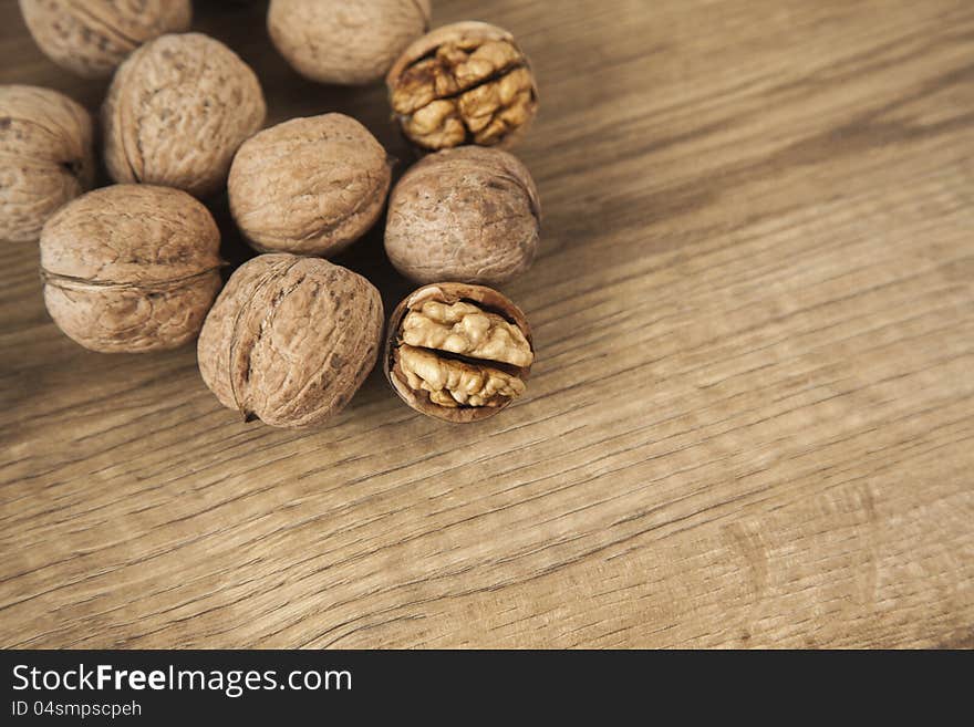 Walnuts on brown wood