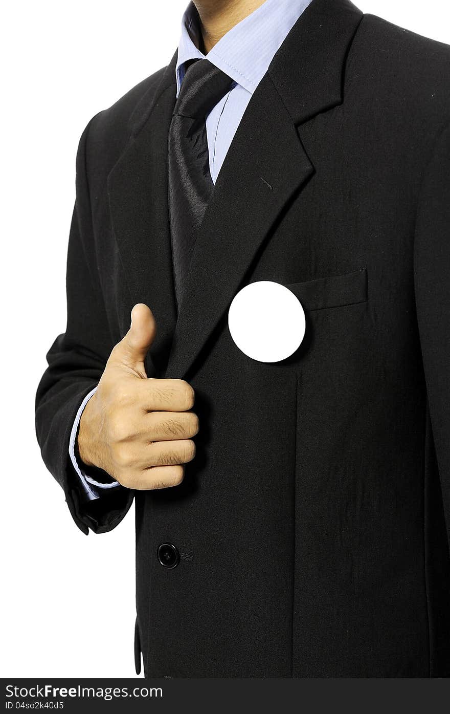 Man with black business suit with blank pinned button give thumb up. You can put your design on the button. Election day background or concept. Man with black business suit with blank pinned button give thumb up. You can put your design on the button. Election day background or concept